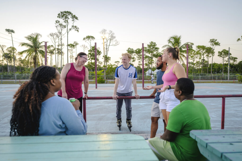 WAUSM students roller skate with friends and family at an evening Island Roll 2026 event at Goombay Land in Freeport, Grand Bahama.